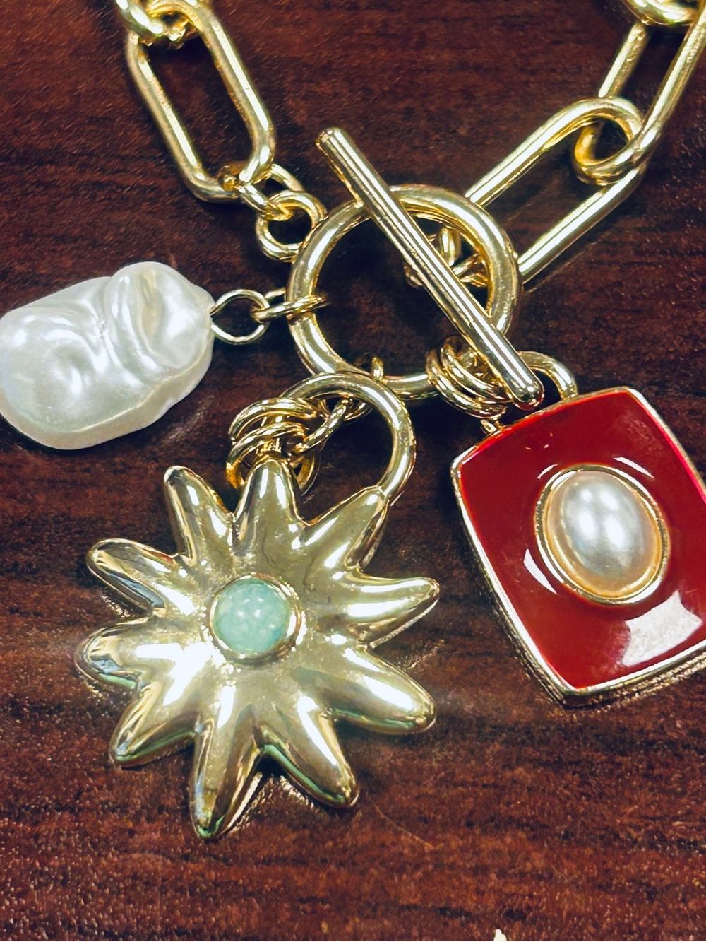 Gold-Tone Charm Toggle Necklace with Red Enamel & Pearl Accents